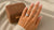 3 carat oval diamond engagement ring on hand showing size and finger coverage