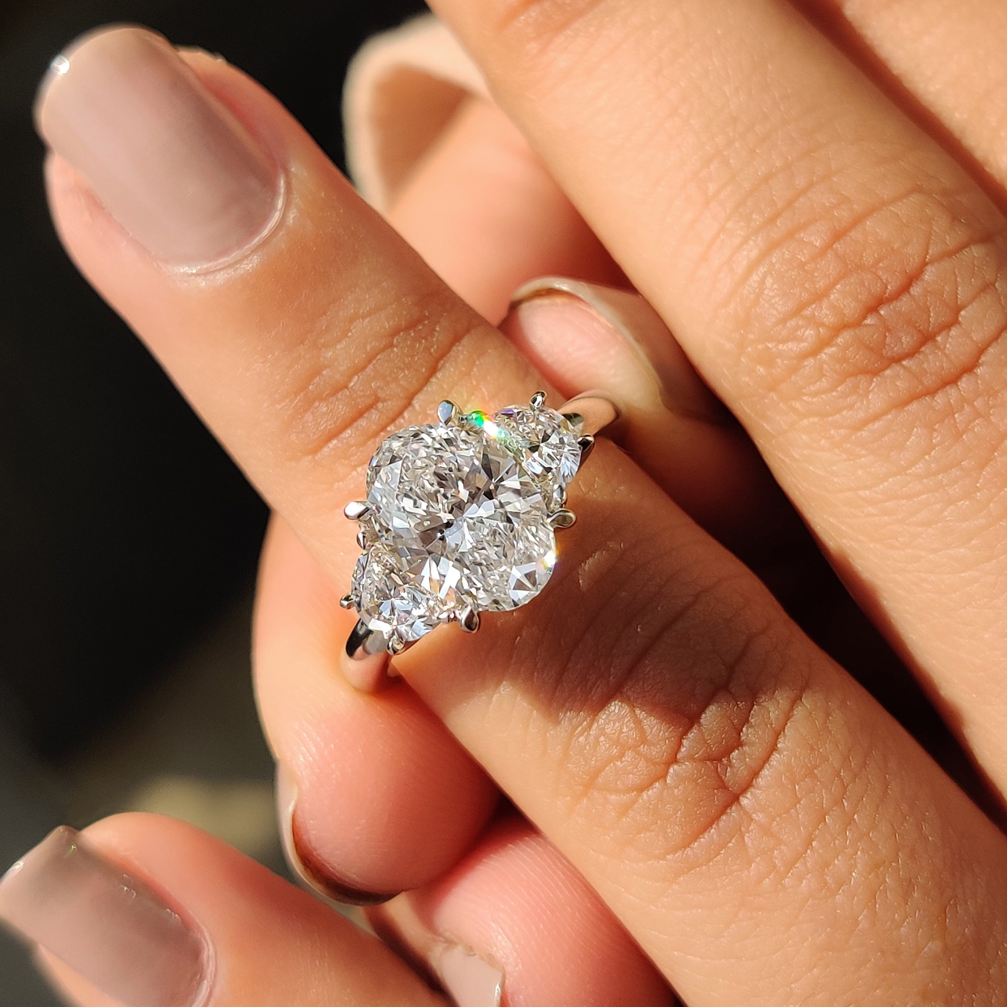 Oval Cut Diamond Engagement Ring With Half Moon Side Stone