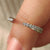 Handmade Jewelry featuring a minimalist wedding band.
