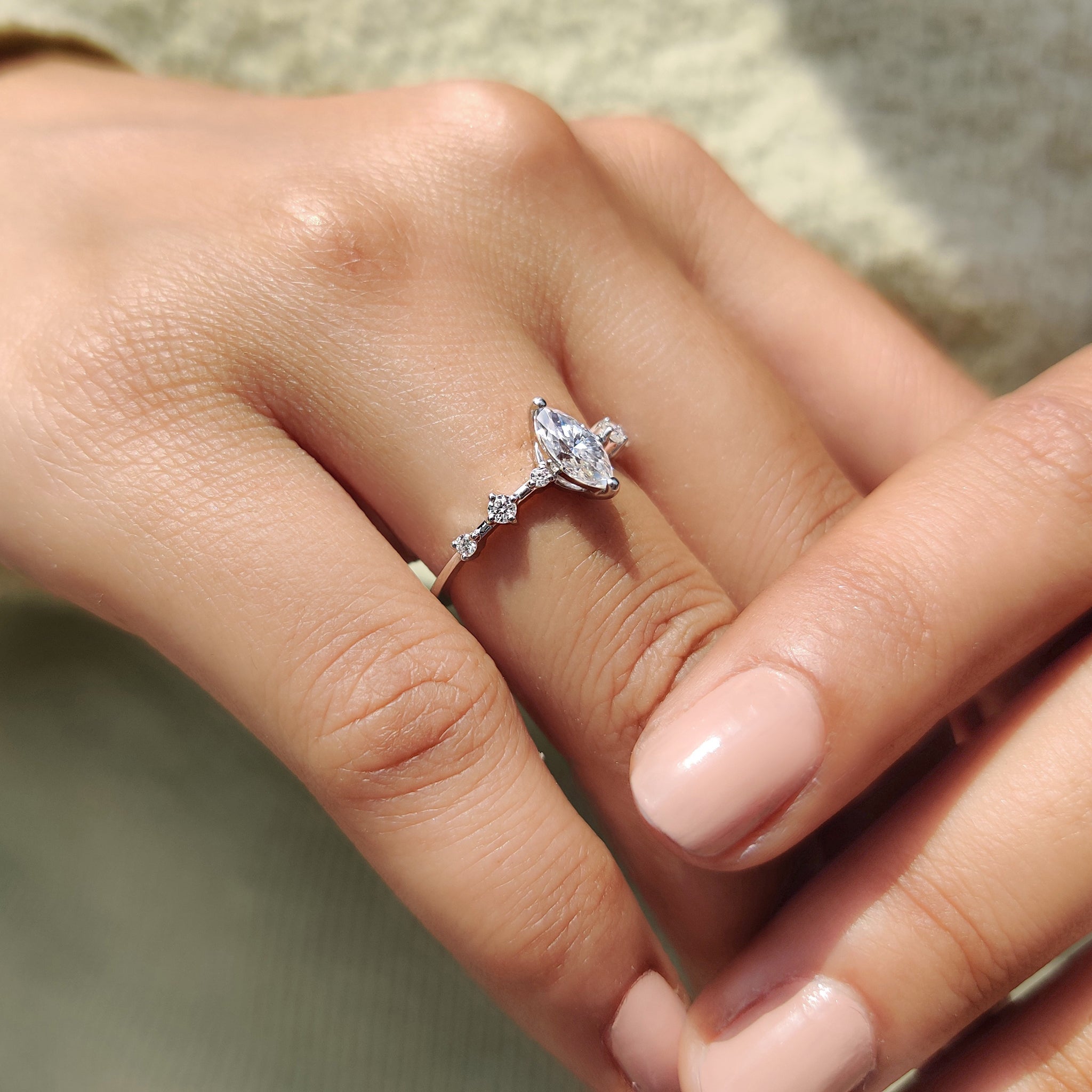Round prong setting secures gems with bright fine beauty.