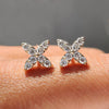 Flower stud earrings with delicate design.

