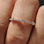 Moissanite half eternity band featuring moissanite stones set halfway for a clean and secure design.