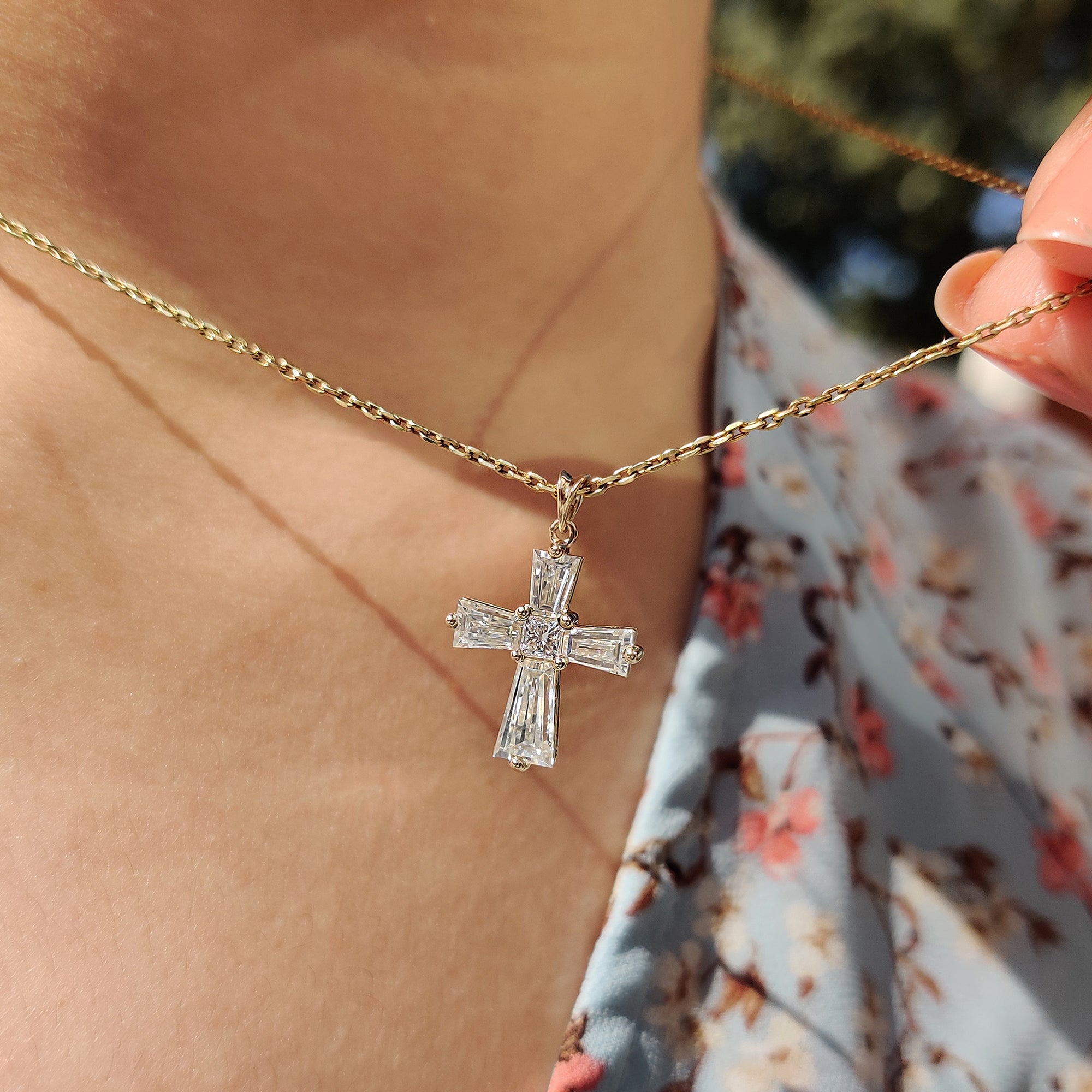 Prong setting holds the moissanite in this handmade pendant.

