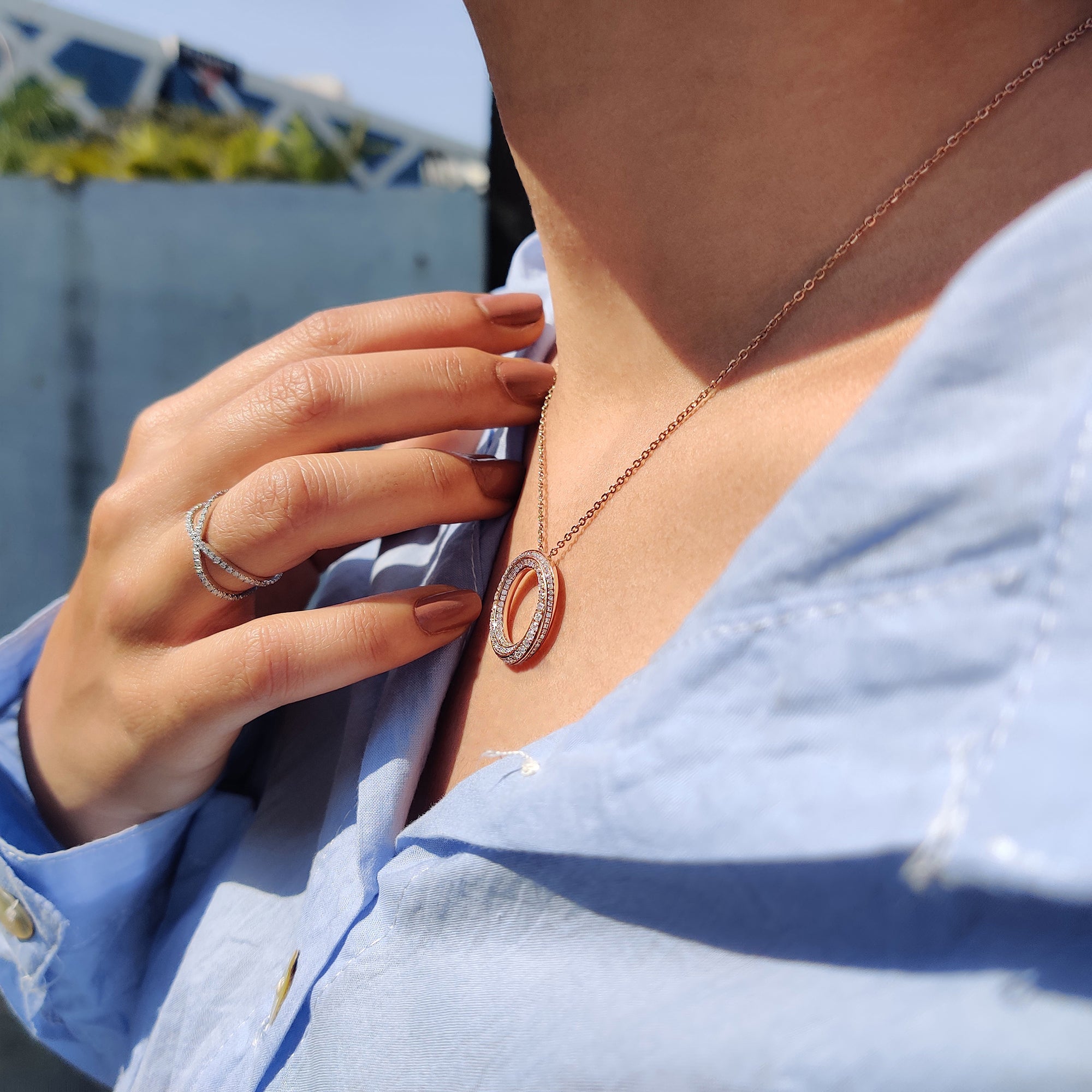 Twisted Circle Pendant made in rose gold pendant with prong set pendant design.
