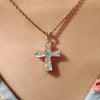 Gold cross pendant made for everyday wear.
