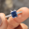 Blue moissanite ring set in a stylish design.
