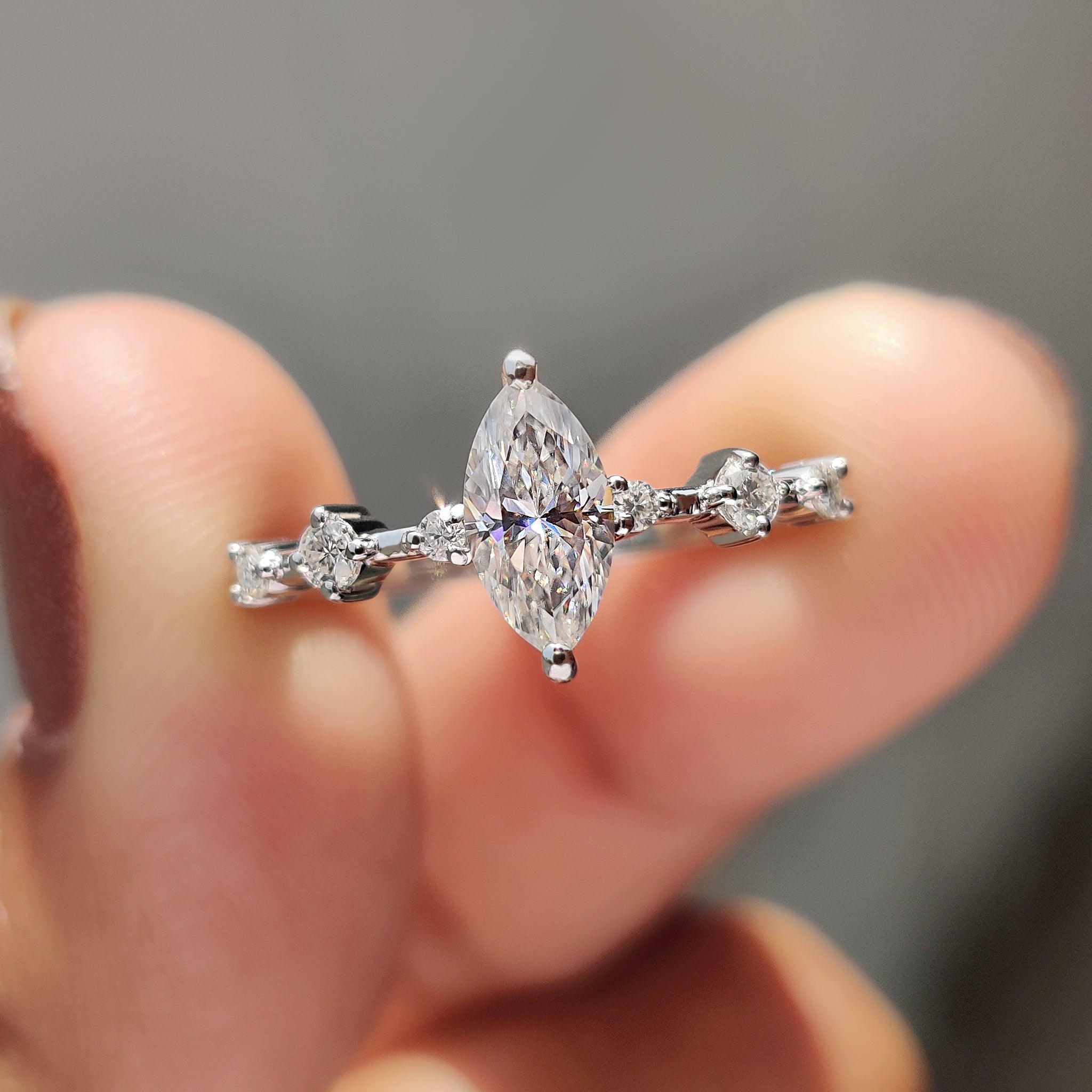 Moissanite marquise ring glows with soft romantic beauty.