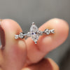 Moissanite marquise ring glows with soft romantic beauty.