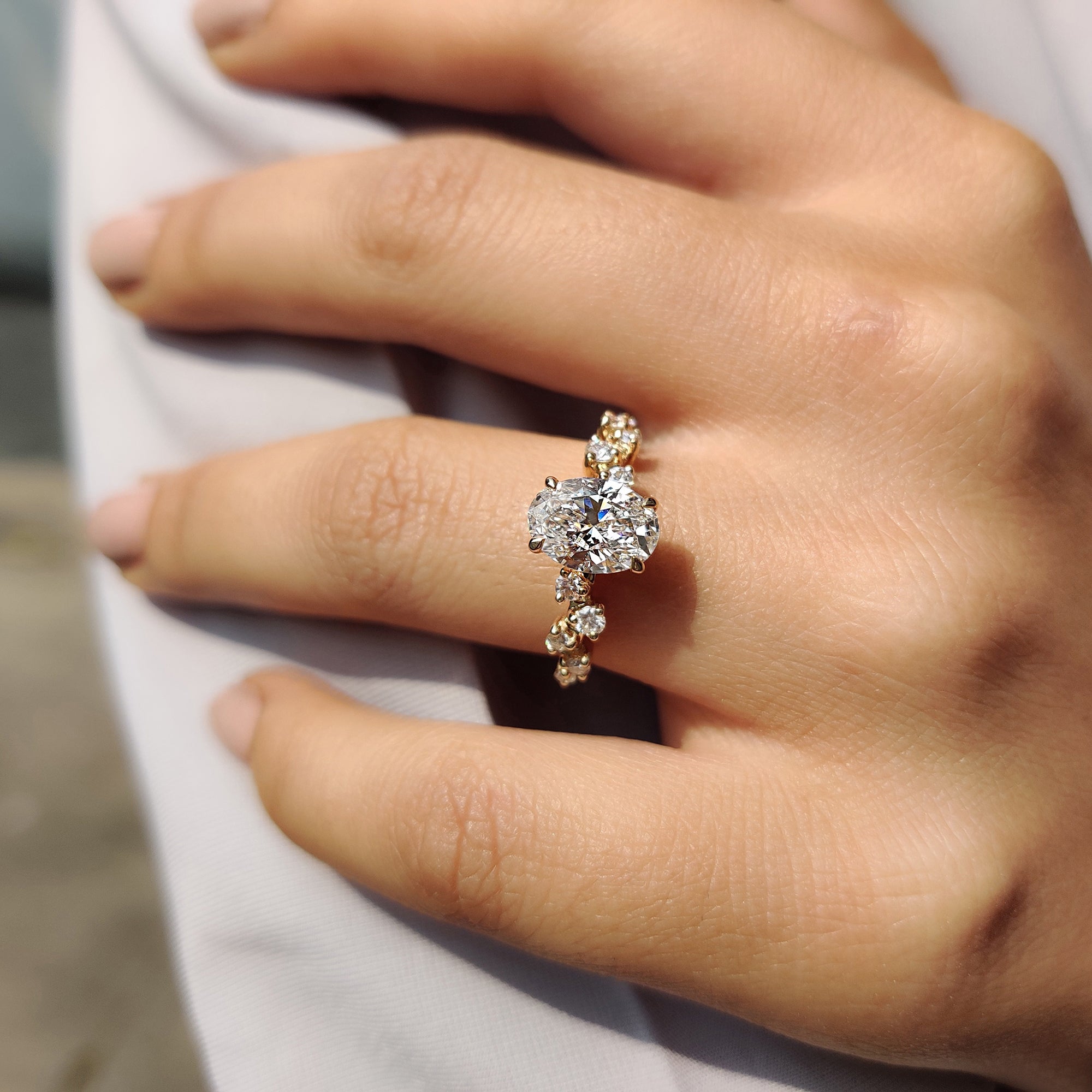 4 prong claw setting engagement ring highlighting a brilliant diamond.
