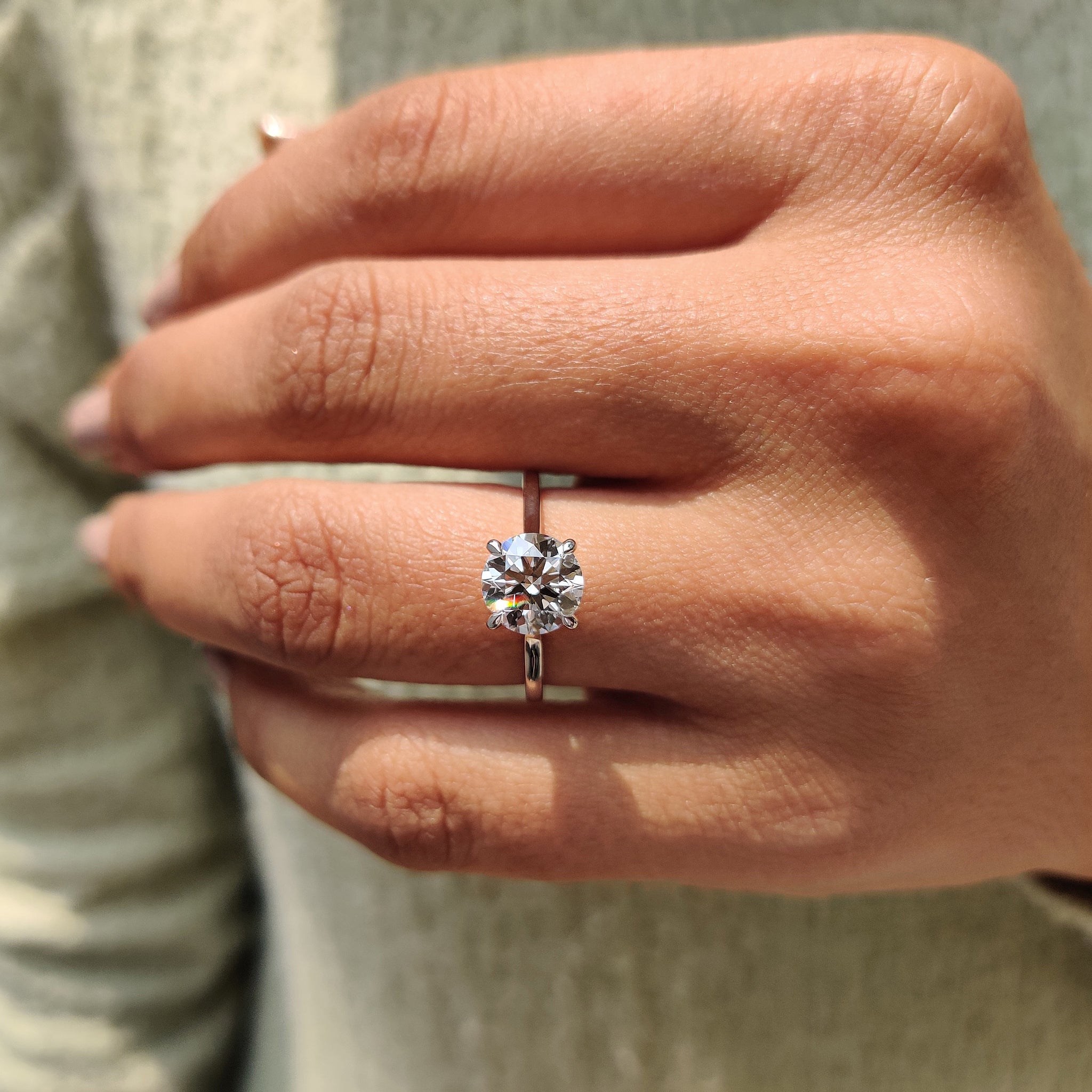 Elegant cathedral ring featuring a brilliant round diamond.
