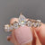 Pear shaped wedding band with soft curves.