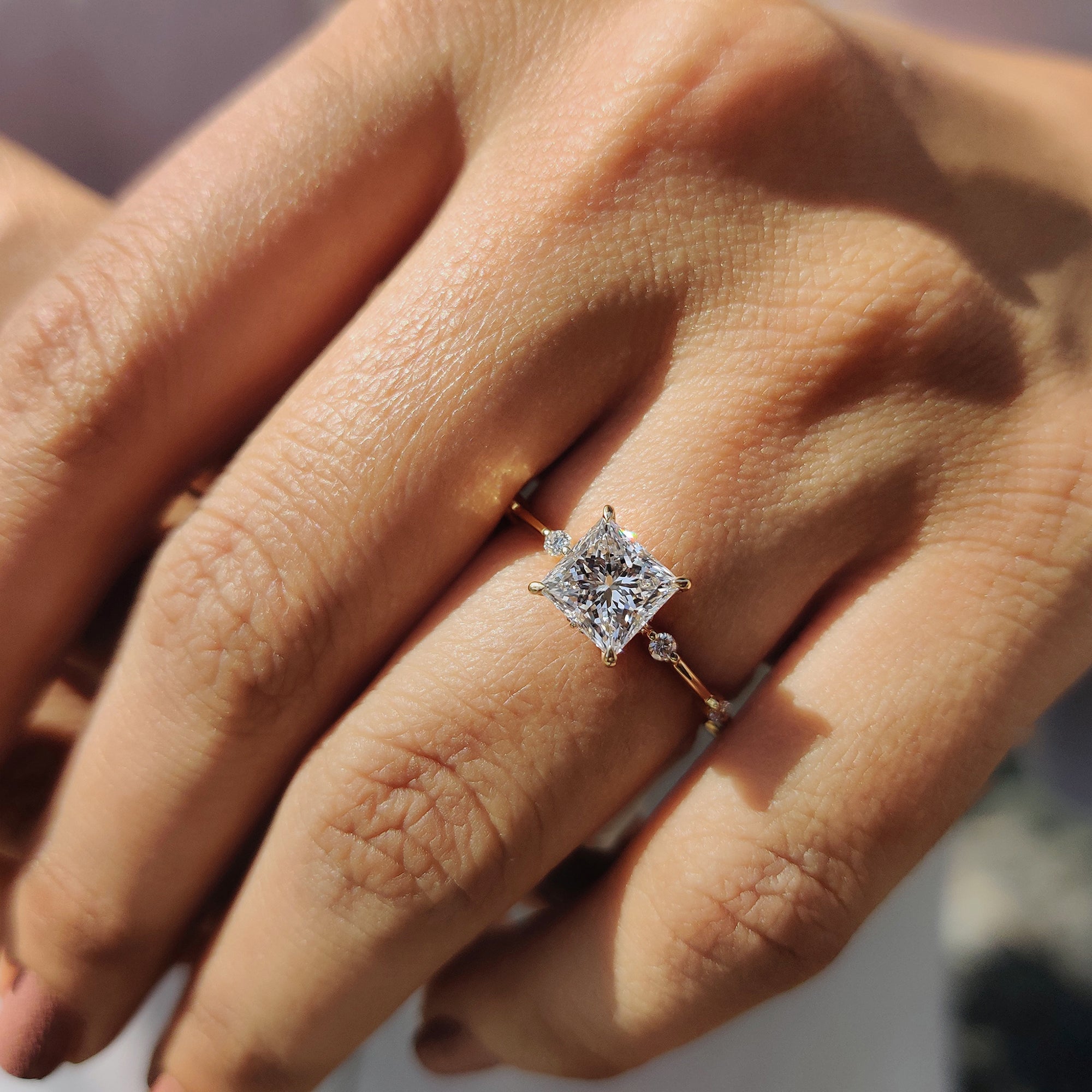 Yellow Gold Engagement Ring with a sparkling Princess Cut Diamond.
