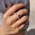 Curvy wedding band designed to fit snugly.