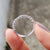 Round cut moissanite band shaped with care.