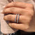 Baguette and round cut wedding band featuring a clean prong setting in white gold.