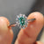 Oval cut engagement ring with a cathedral setting, handmade for those who appreciate height, light, and graceful detail.