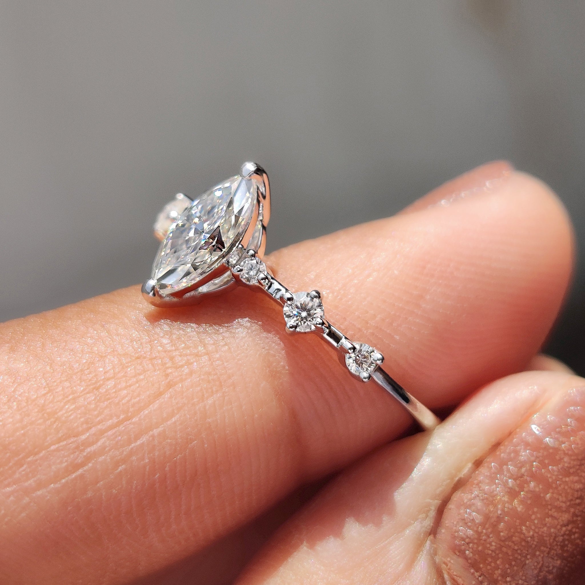 Marquise and round cut ring balances beauty with grace.