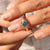 Yellow gold engagement ring with twisted rope band