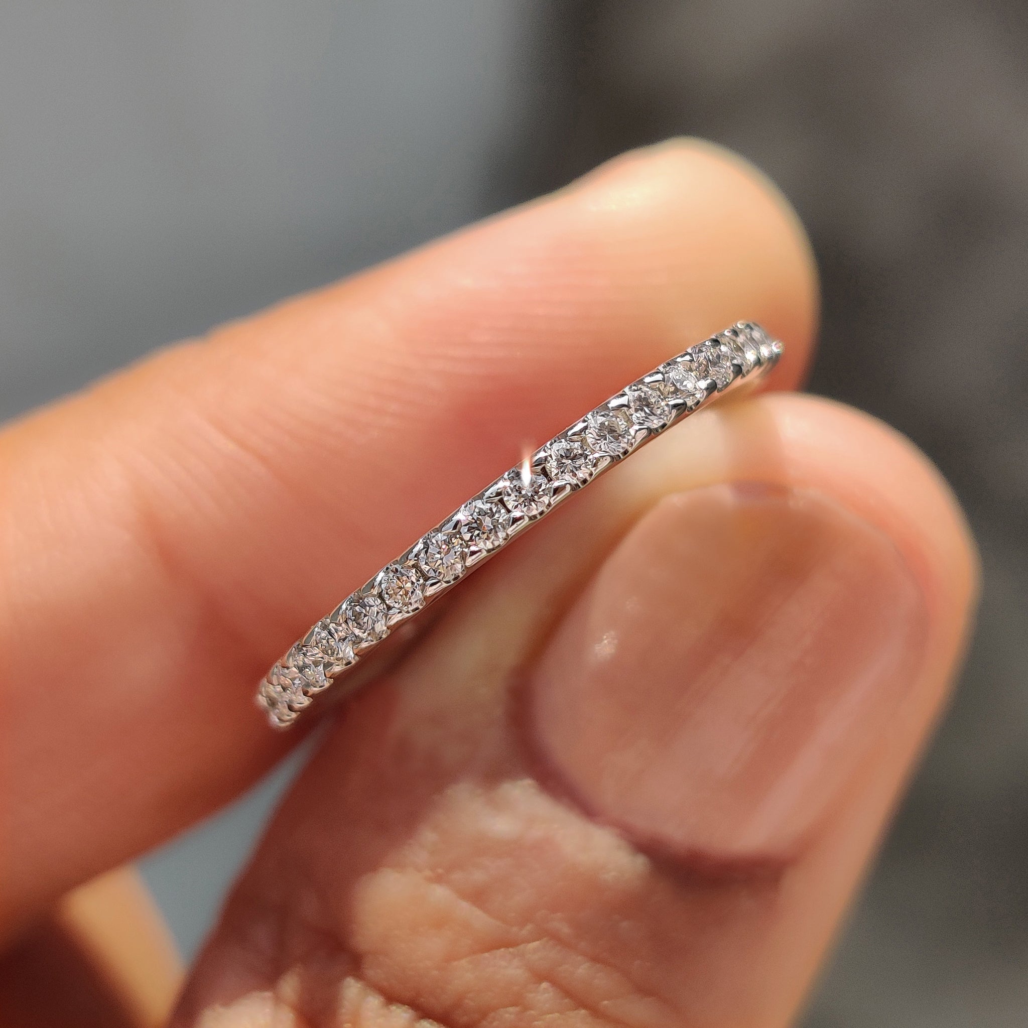 Round cut wedding band with sparkling diamonds.
