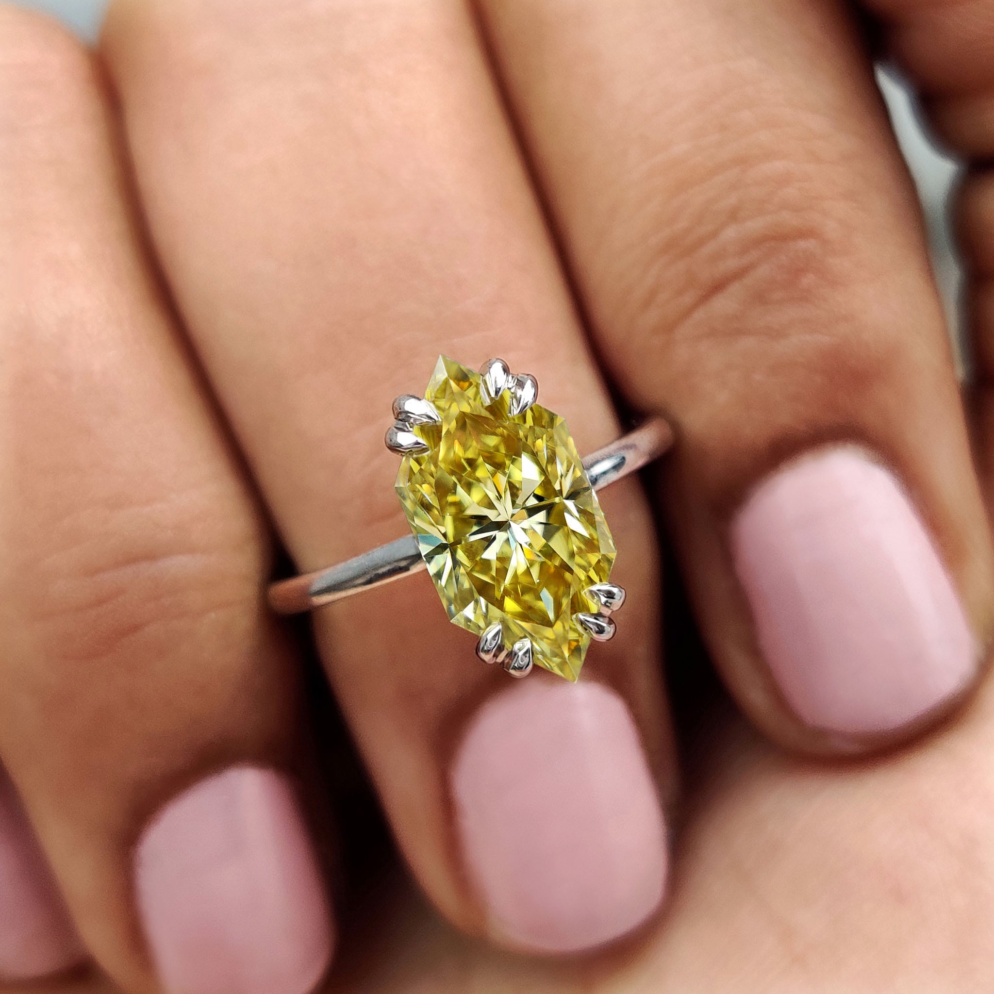 Round hidden halo ring for a contemporary twist on a classic design.
