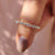 Rose gold wedding band with round-cut lab-grown diamonds.