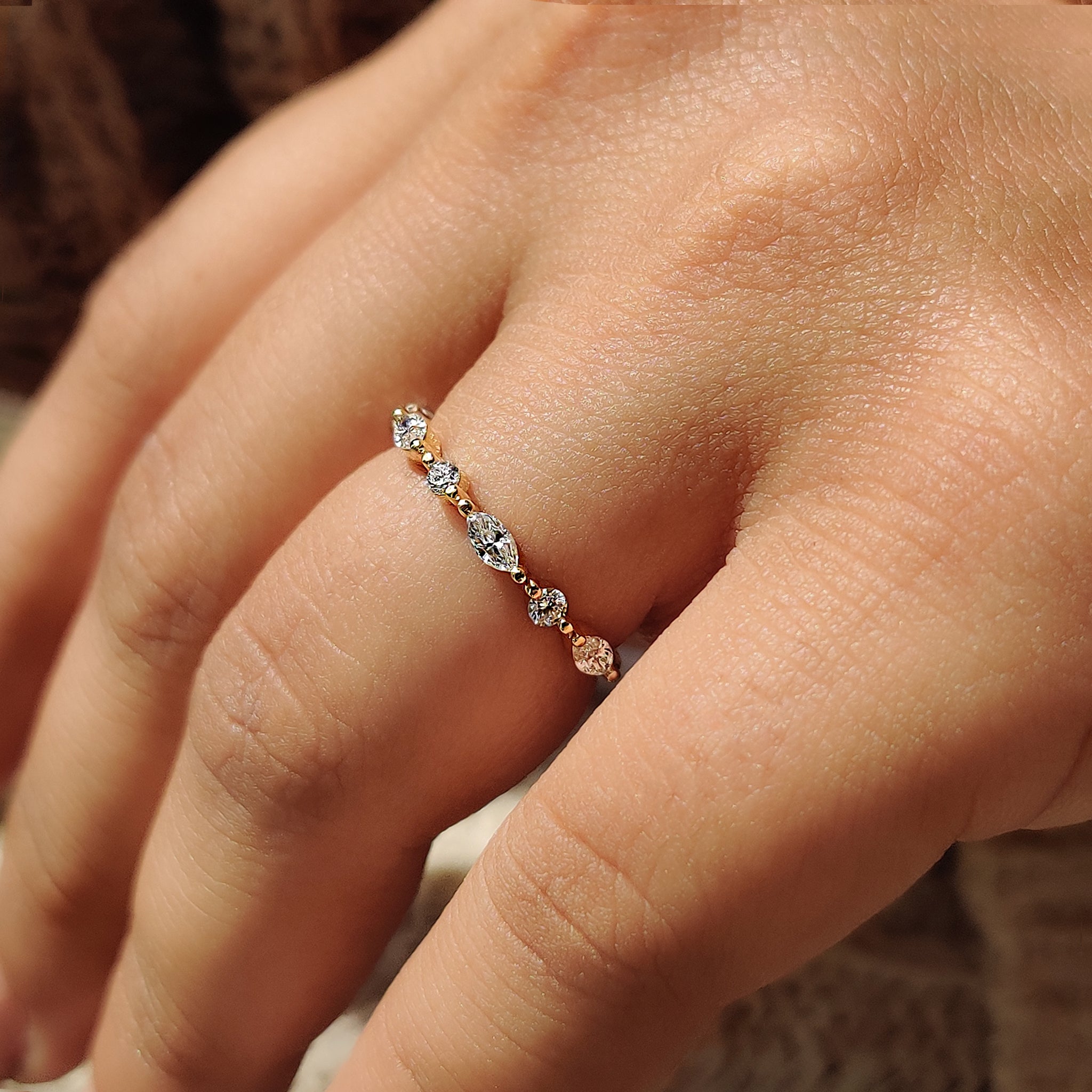 A round cut diamond band with yellow gold wedding band.