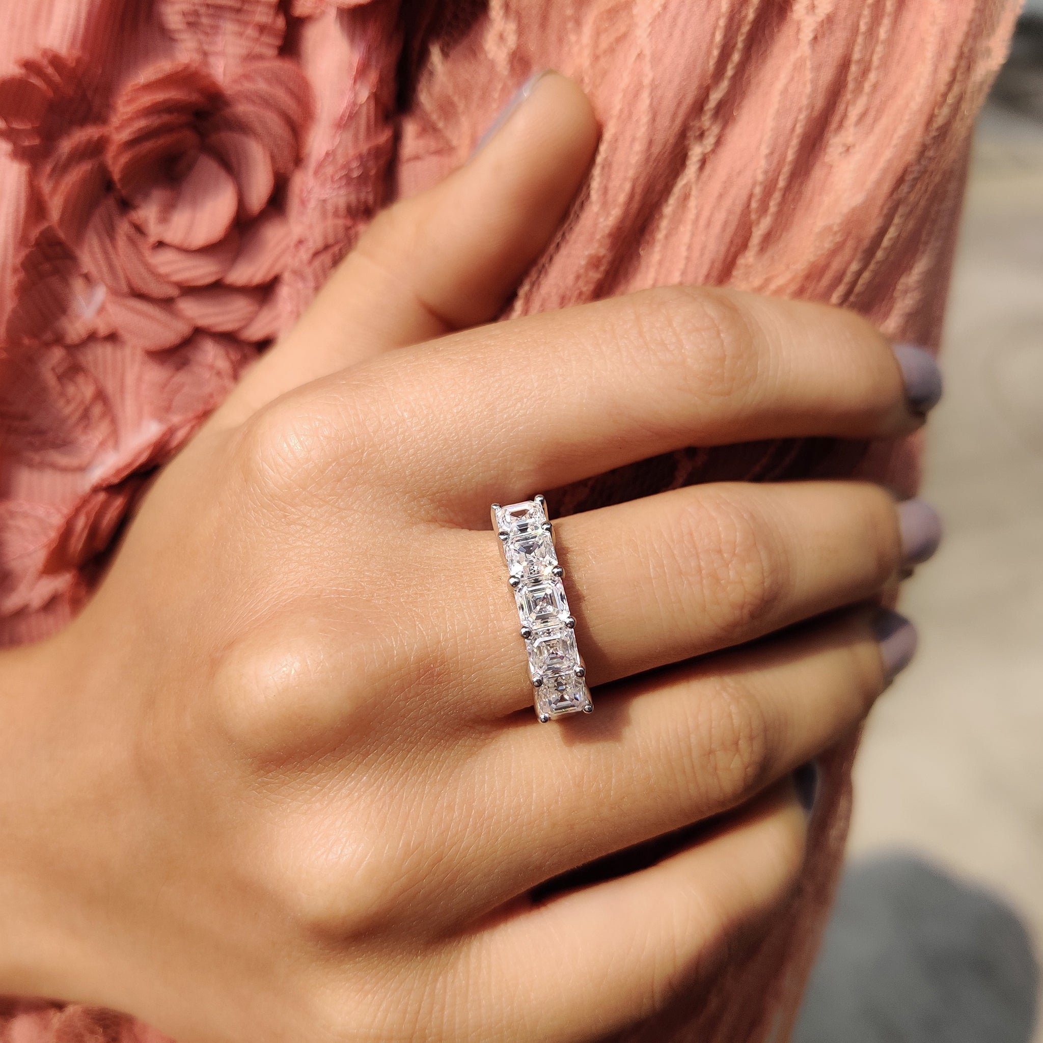 Half eternity wedding band gives stones across half the band.