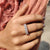 Half eternity wedding band gives stones across half the band.