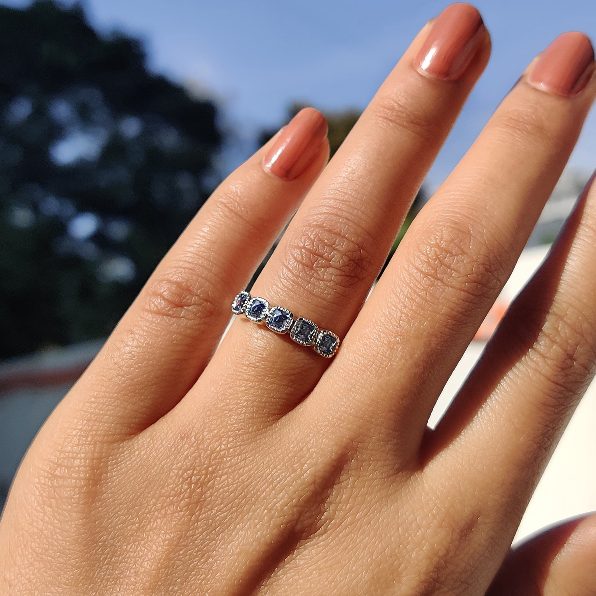 Moissanite wedding band with French cut and milgrain bezel.