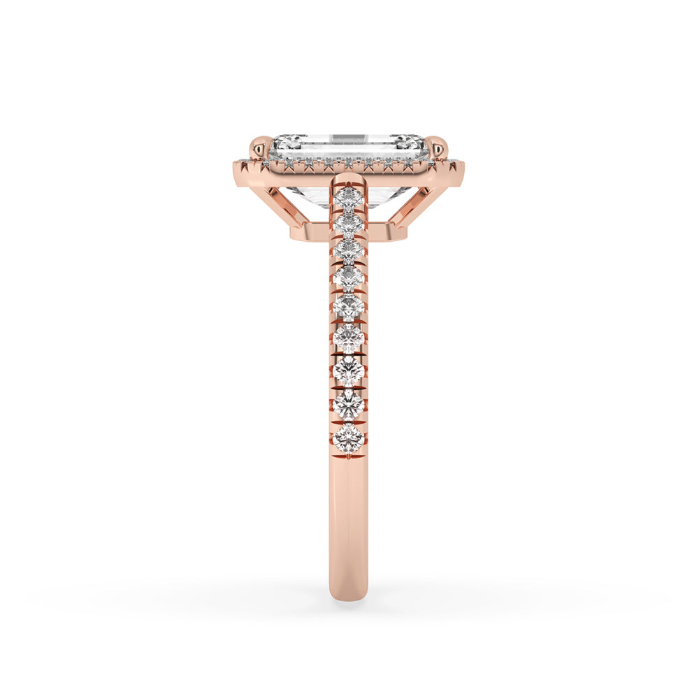 Halo cut diamond set in an emerald cut ring with halo and a gold pave ring for a luxurious look.