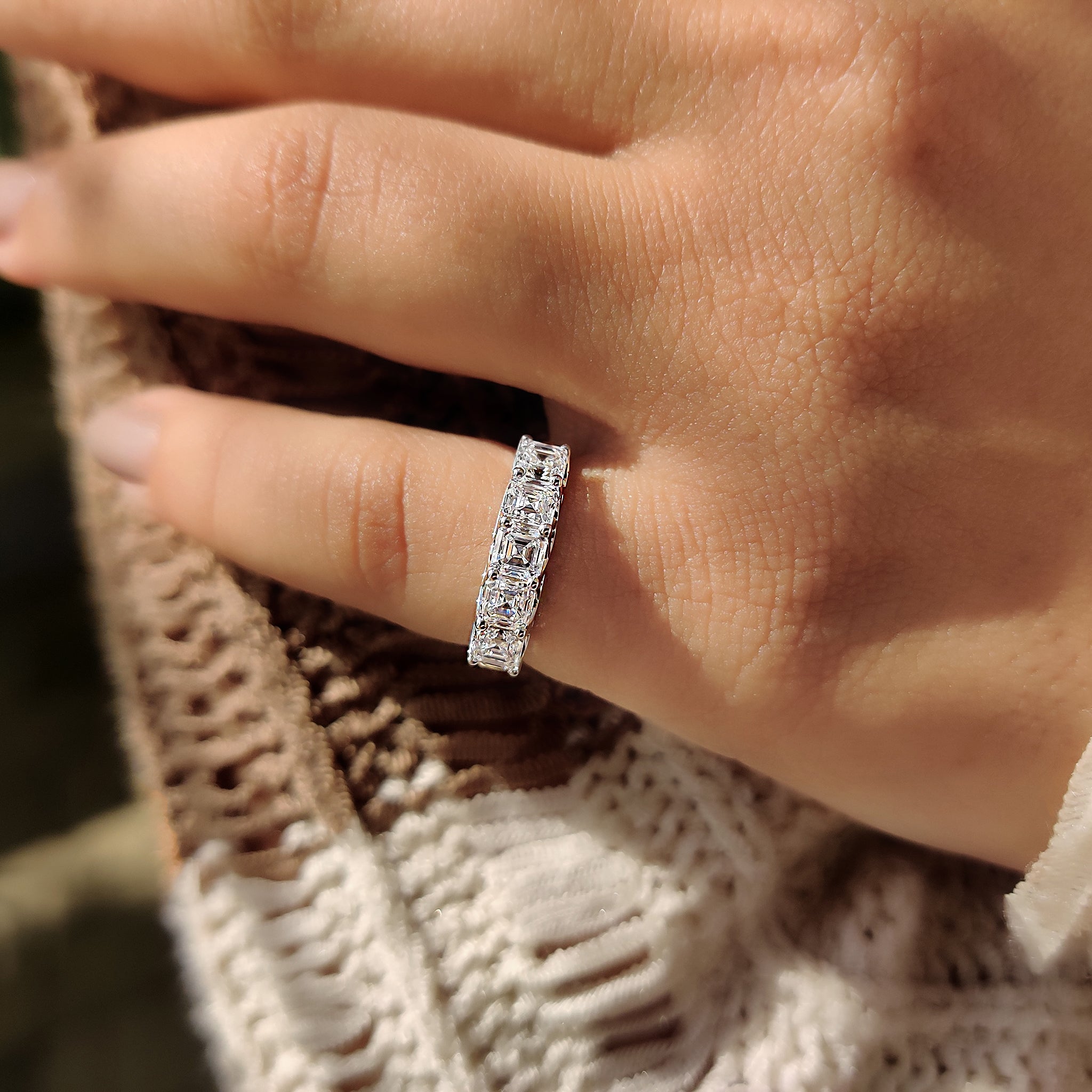 Five stone Asscher cut diamond ring with shared prong white gold band