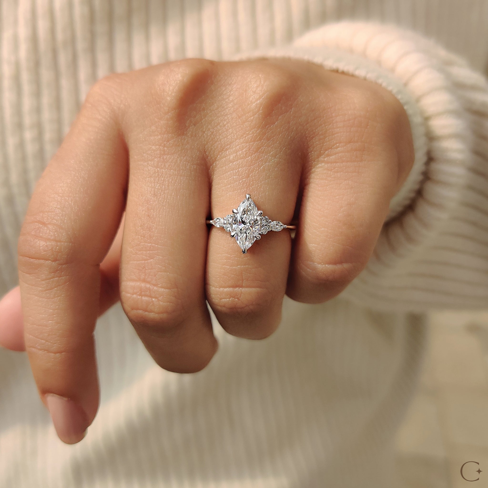 Marquise and round side diamonds for added brilliance.
