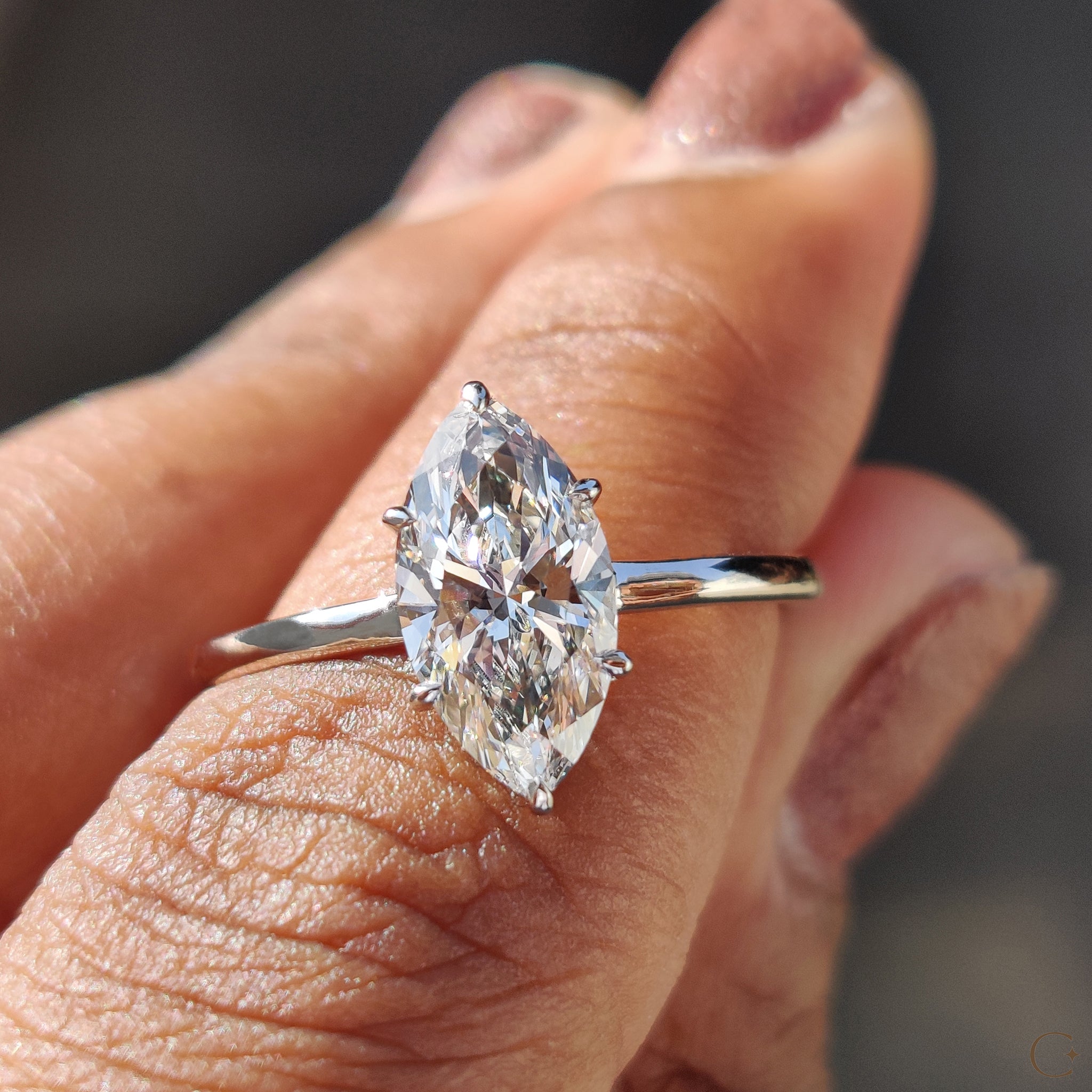 Marquise cut engagement ring with a dazzling center diamond.
