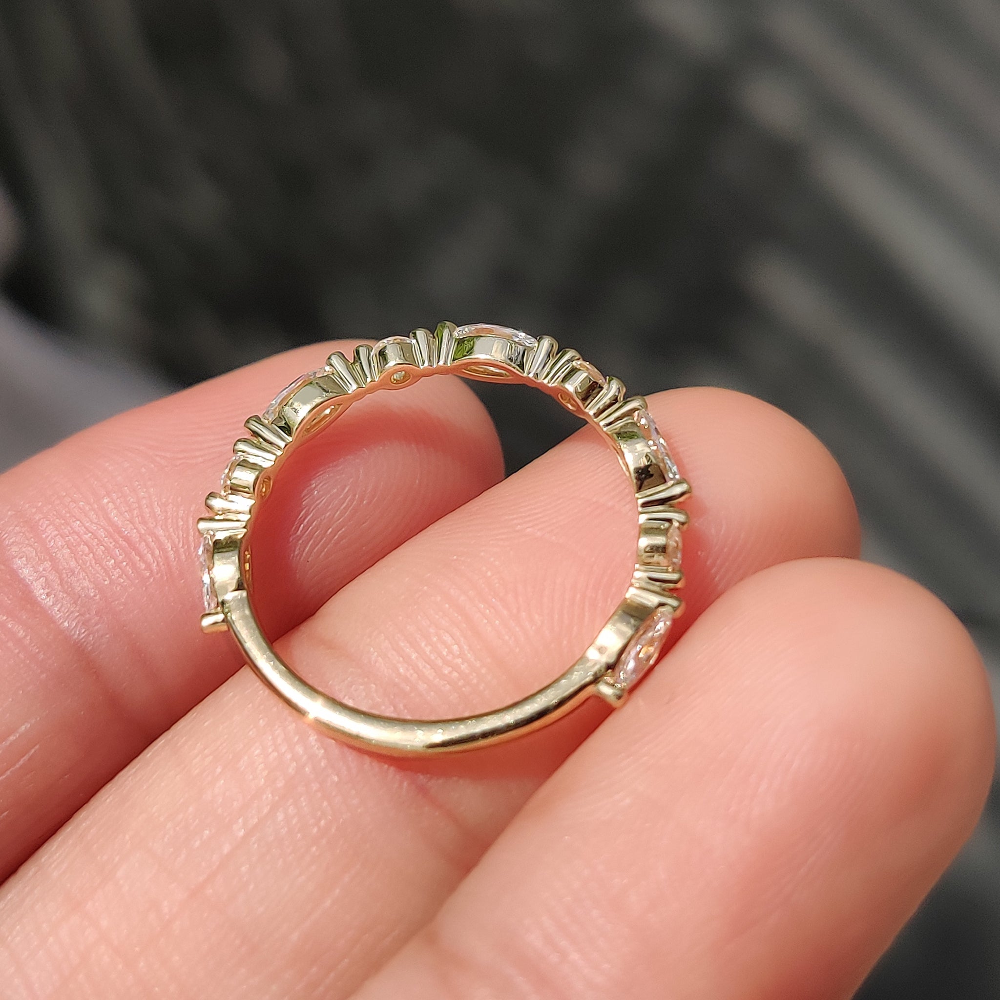 A yellow gold wedding band with buy wedding band.