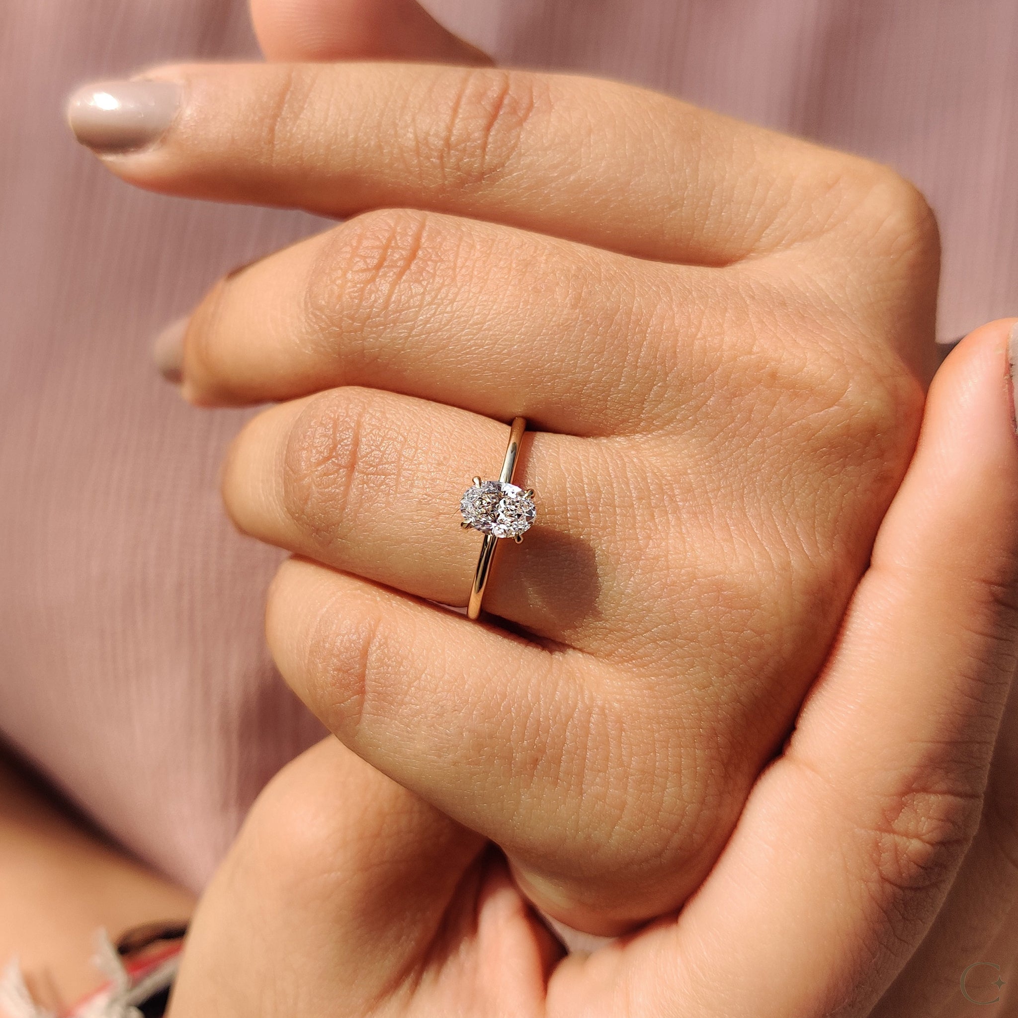 Solitaire engagement ring featuring a beautiful oval diamond.
