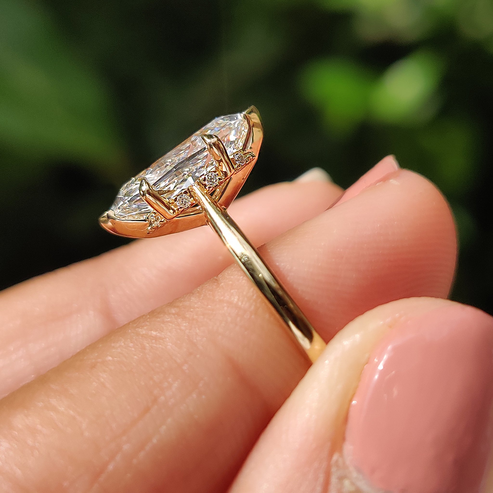 V prong setting with yellow gold engagement ring.