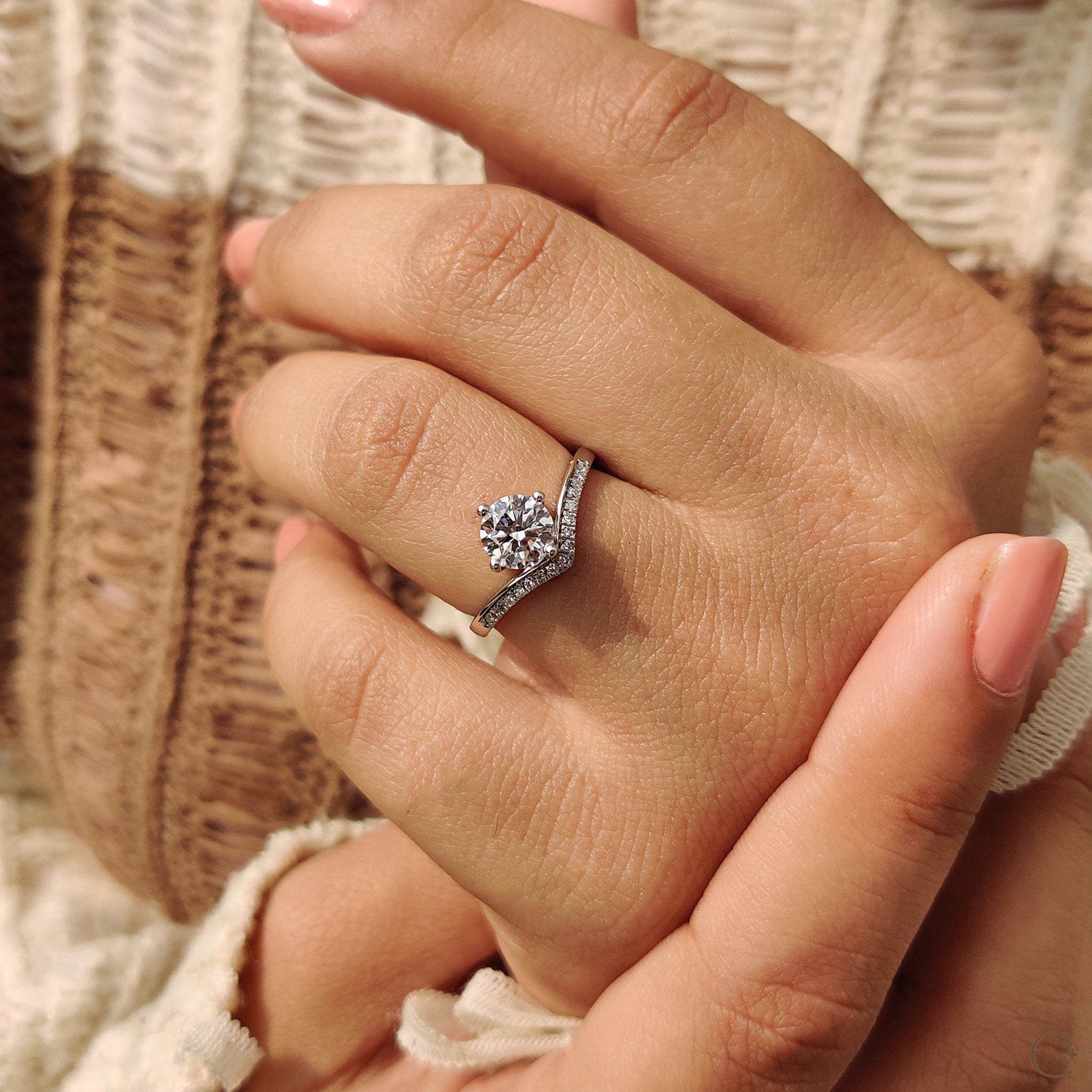 V-shaped ring with a sleek, minimalistic design.
