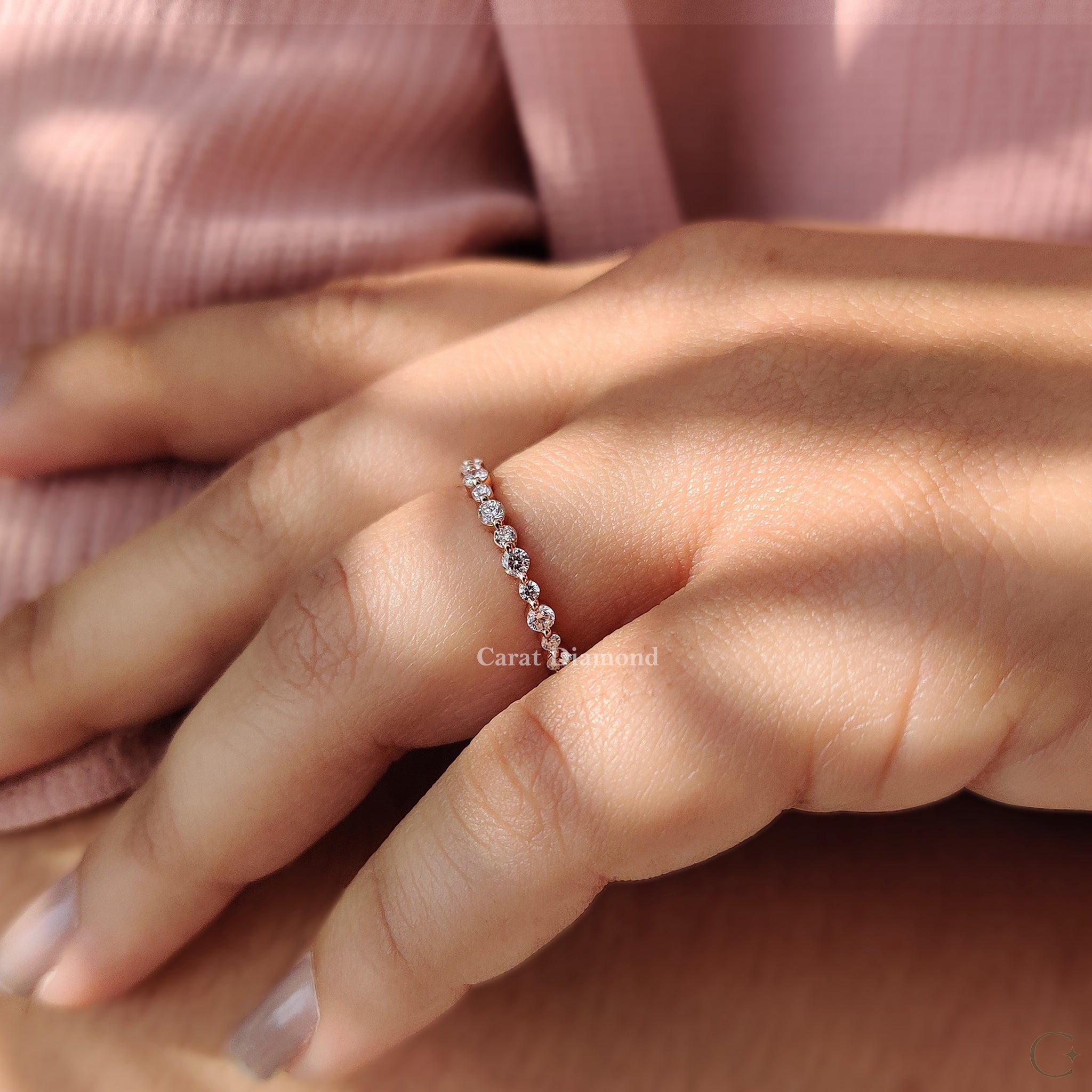 Carat Diamonds wedding band with shared prong design.