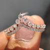 Rose gold band adorned with carat diamonds, perfect as a moissanite wedding band.