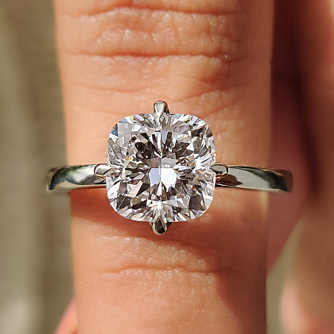 Cushion diamond engagement ring in white gold.
