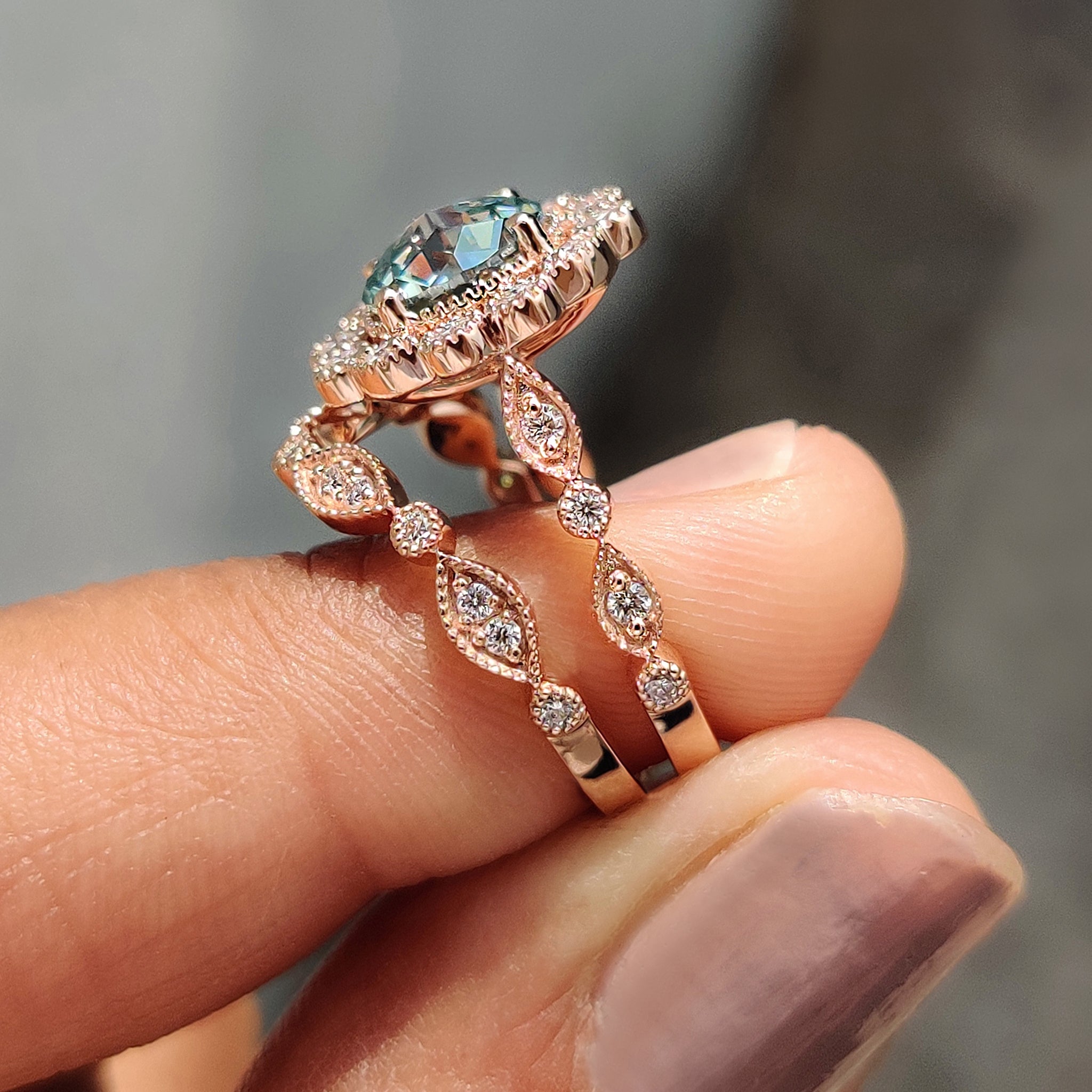 Vintage engagement ring with a cathedral setting and curved wedding band.
