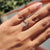 Cluster ring setting creates a beautiful focal point.