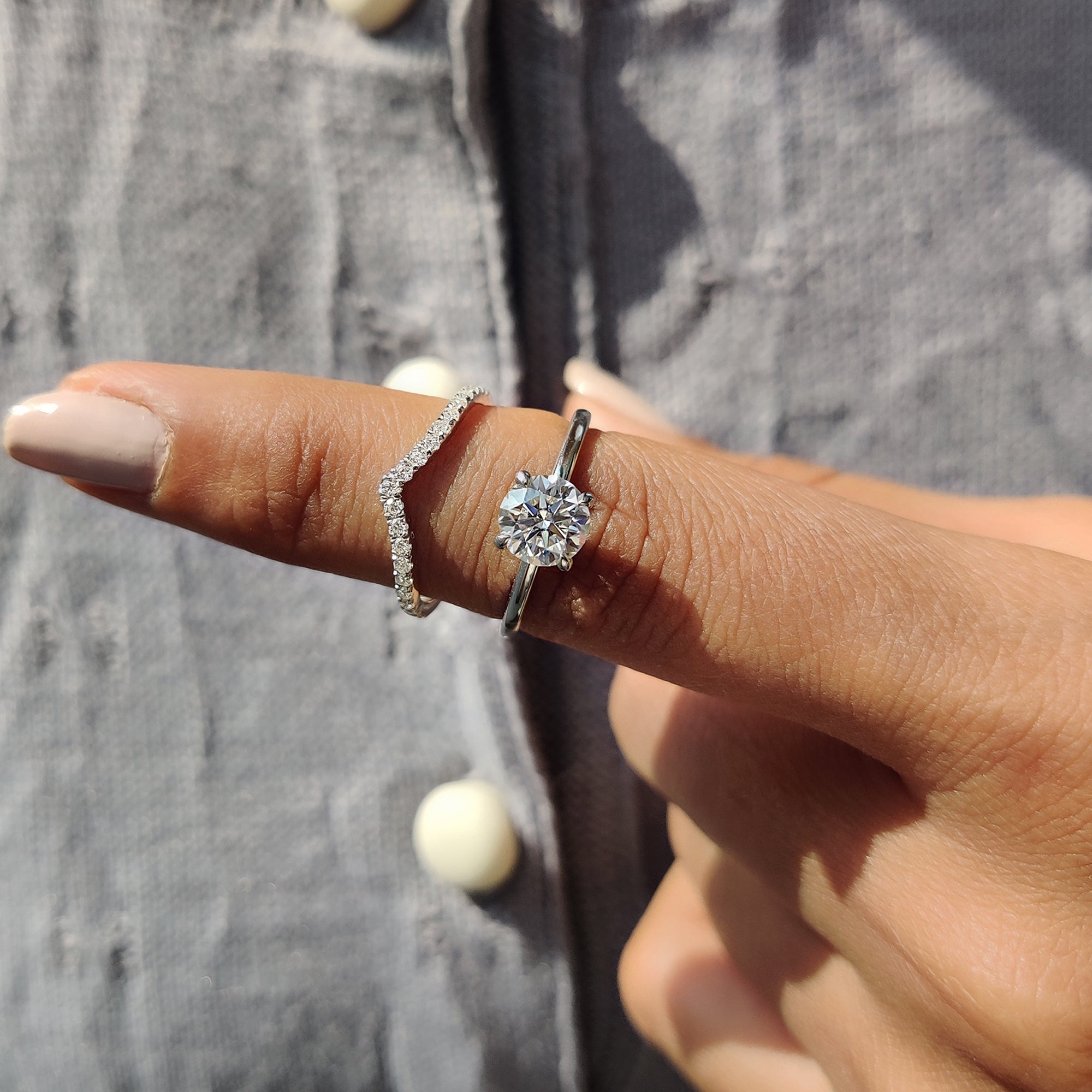 Handmade jewelry bridal set with moissanite stone and a curved wedding band.
