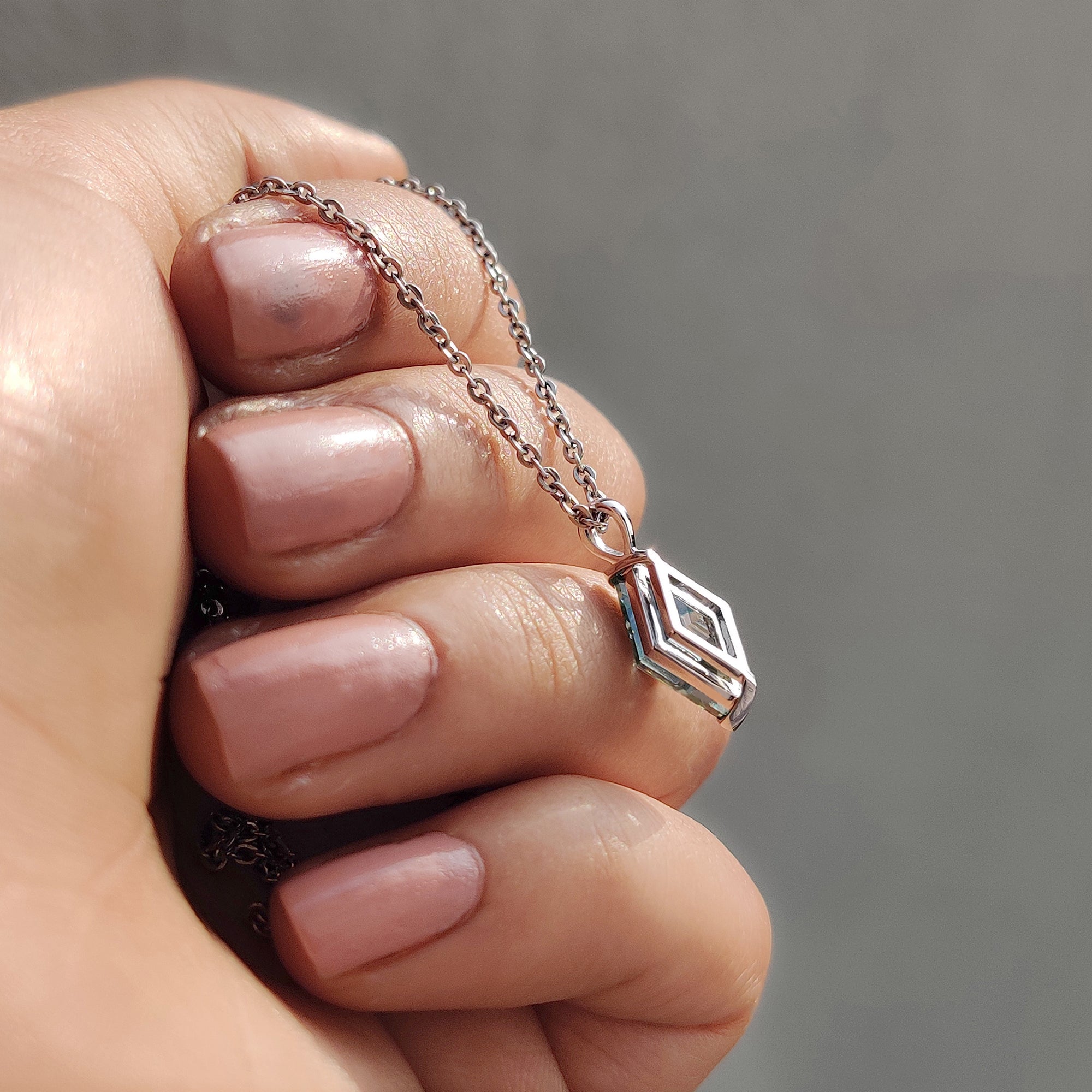 2 v prong setting featured in delicate solitaire pendant and custom moissanite pendant.
