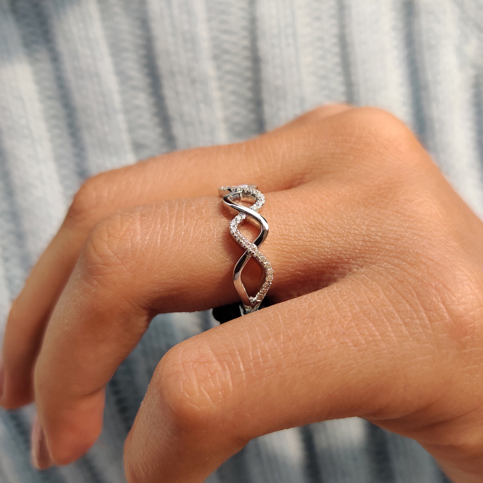 Moissanite wedding band featuring a twisted design for added texture.