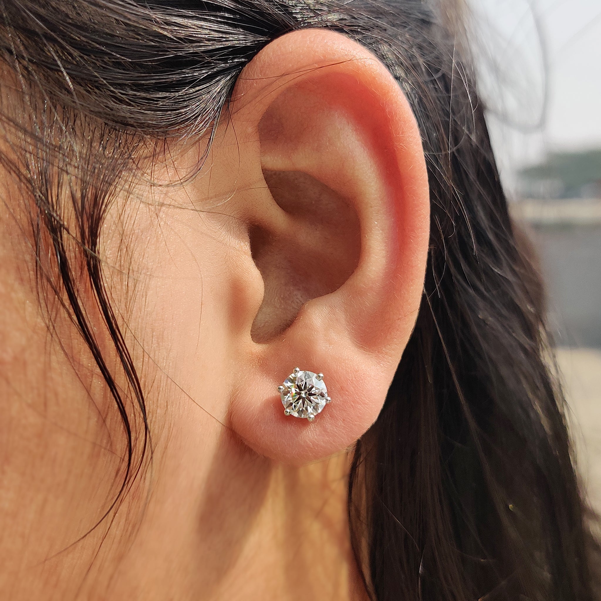 Six prong diamond earrings in elegant handmade jewelry.