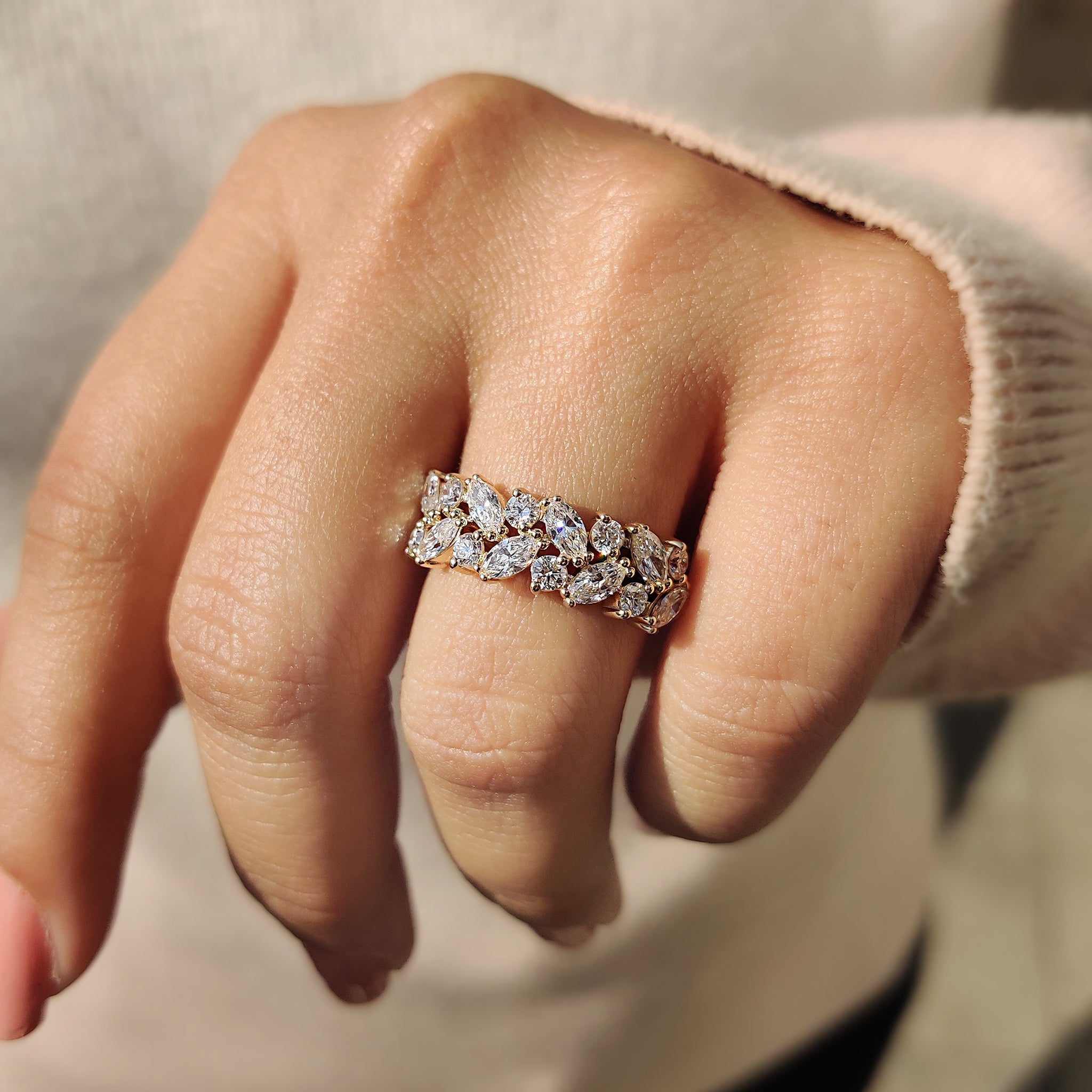 Unique wedding band displayed on a stone surface.
