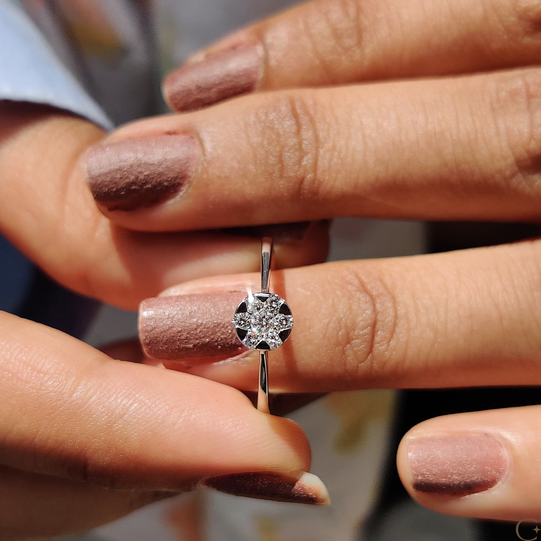 Carat Diamonds ring featuring a round cut diamond setting.