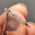 Round and marquise wedding band with half eternity design.