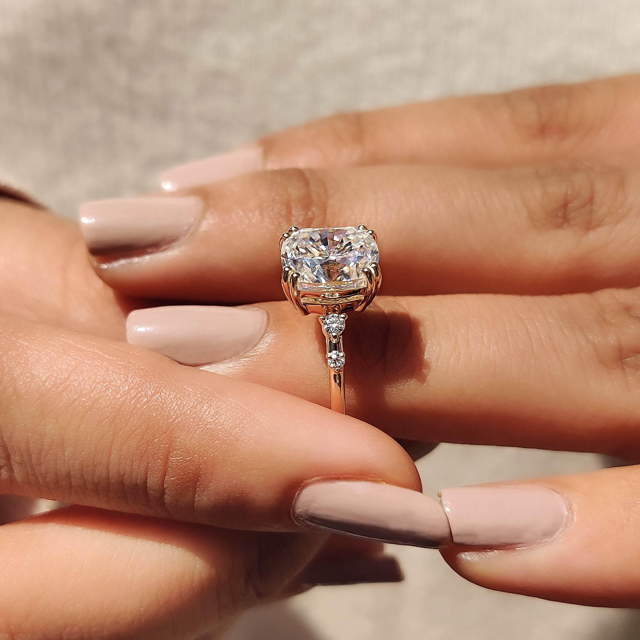 Custom engagement ring with moissanite and gold.
